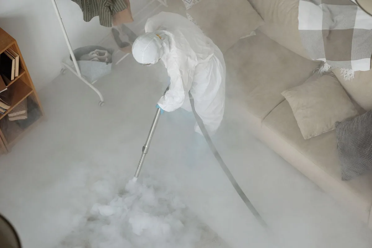 Biohazard cleanup technician in protective equipment, Arlington, TX